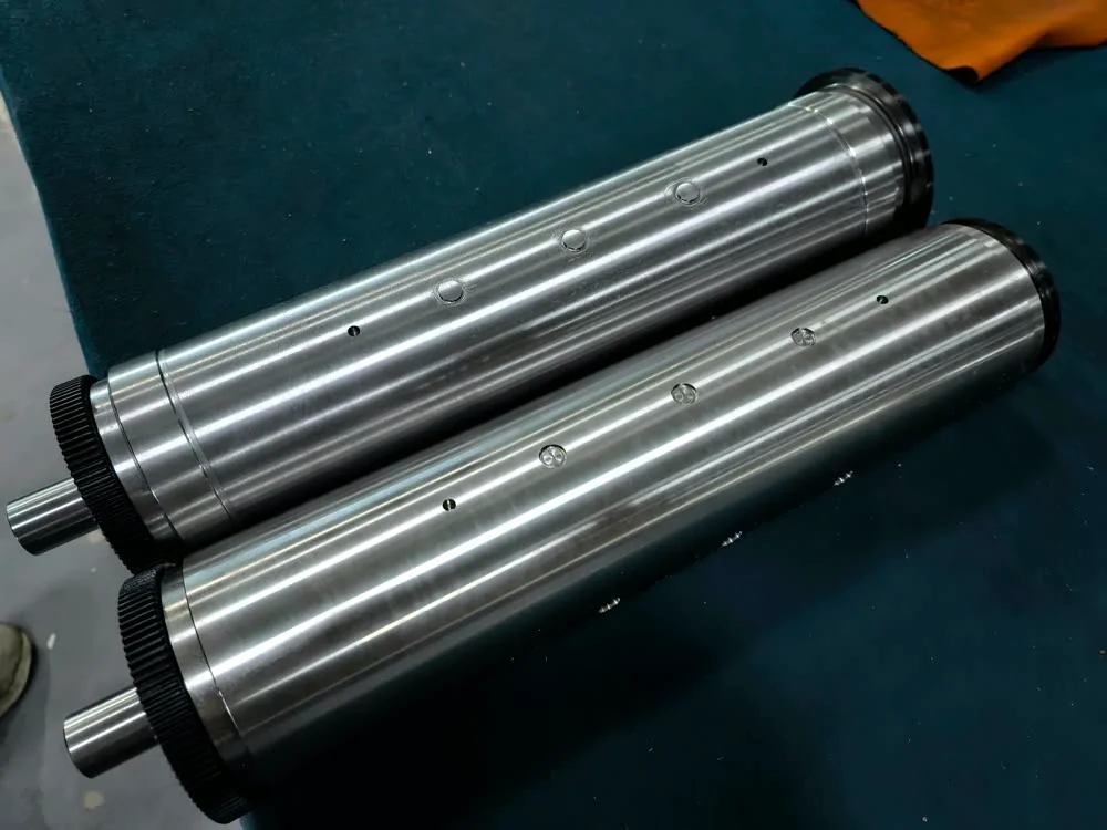 The two embossing cylinders, male and female, in the workshop