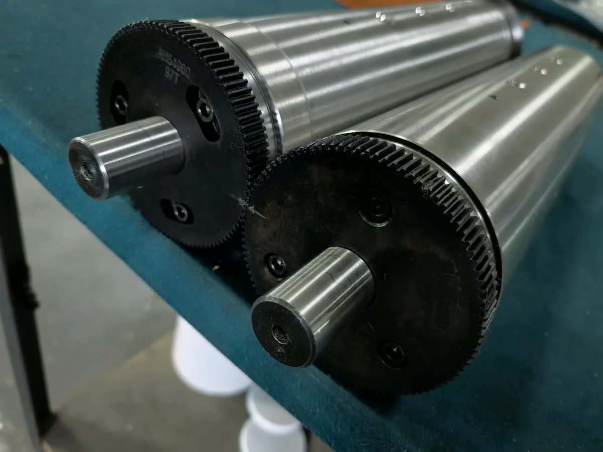 Pair of embossing cylinders with their gears